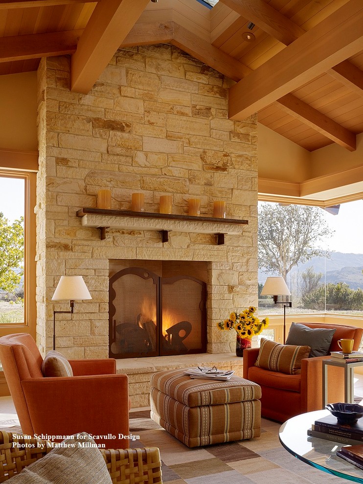 Inspiration for a large transitional open concept limestone floor family room remodel in San Francisco with beige walls, a standard fireplace and a stone fireplace
