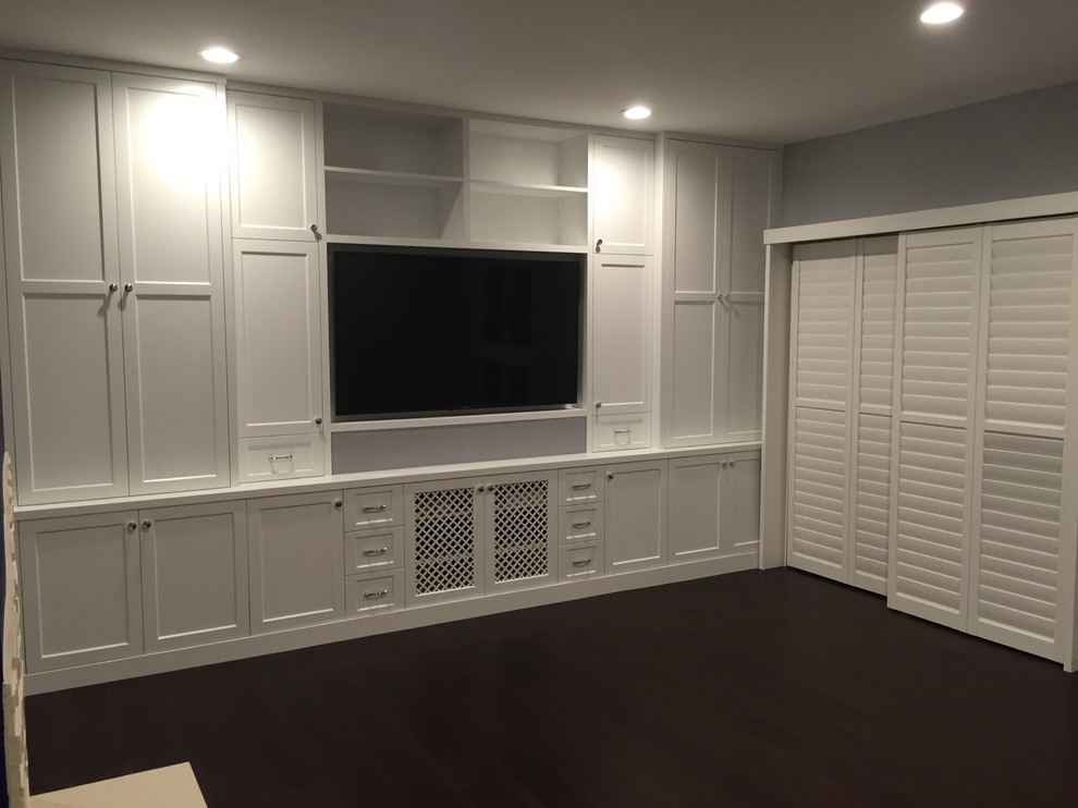 Large classic open plan games room in Los Angeles with white walls, carpet, no fireplace and a built-in media unit.
