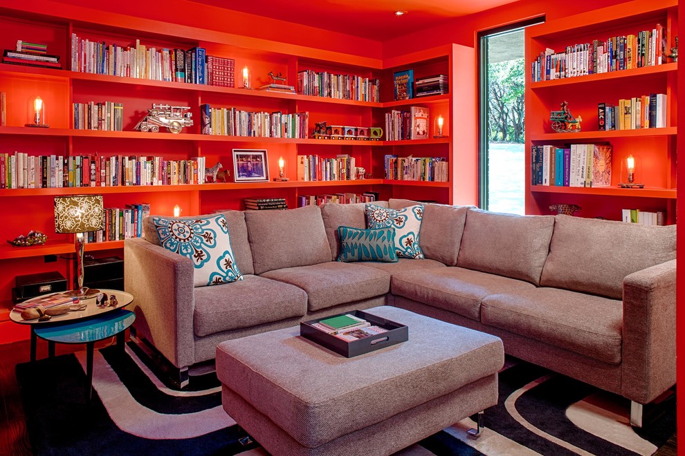Inspiration for a contemporary family room library remodel in Austin with red walls