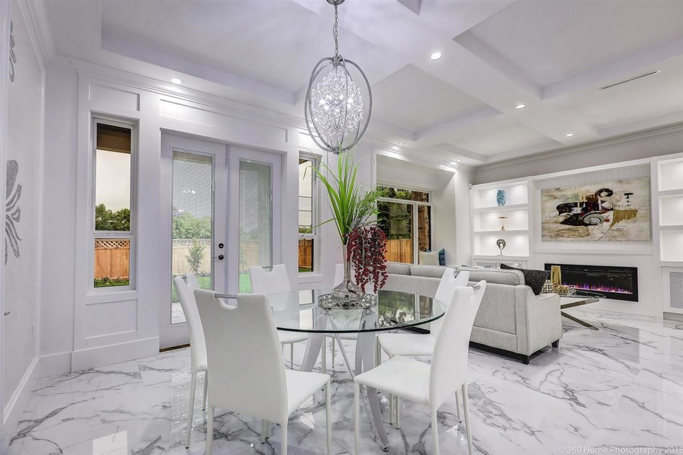 Medium sized traditional dining room in Vancouver with white walls, marble flooring, a ribbon fireplace, a stone fireplace surround and grey floors.