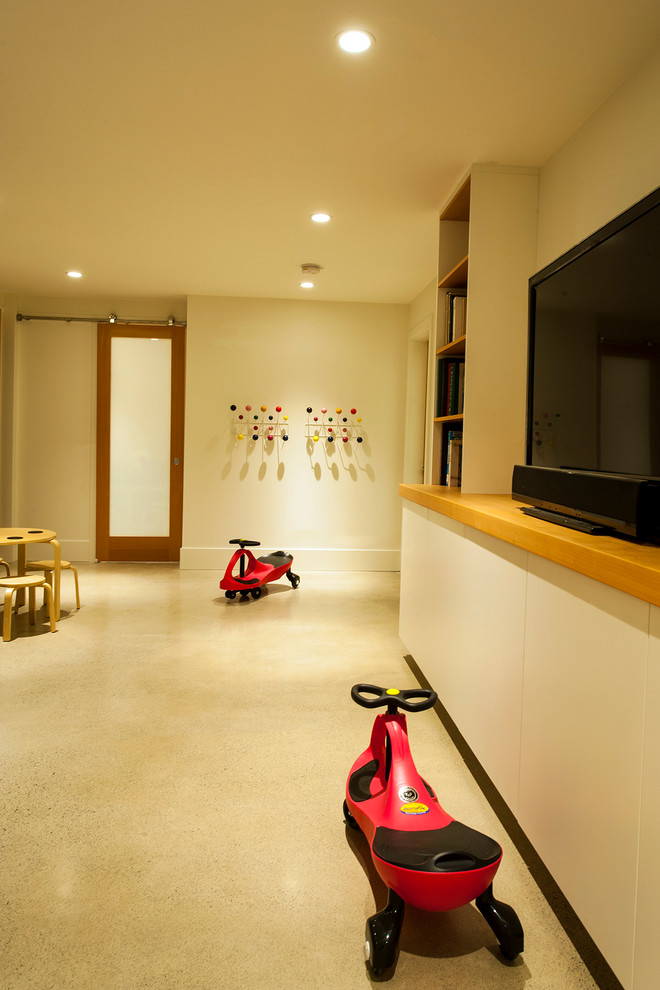 Mid-sized mid-century modern open concept concrete floor family room photo in Vancouver with white walls, a media wall and no fireplace