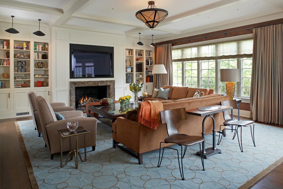 Inspiration for a large timeless open concept medium tone wood floor family room remodel in New York with brown walls, a standard fireplace, a wall-mounted tv and a tile fireplace