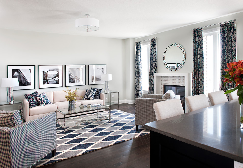 Inspiration for an expansive classic open plan games room in Ottawa with grey walls, dark hardwood flooring, a standard fireplace and a tiled fireplace surround.