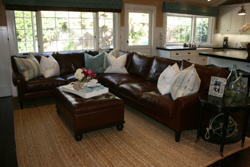 Medium sized beach style open plan games room in Orange County with dark hardwood flooring, beige walls and a concealed tv.