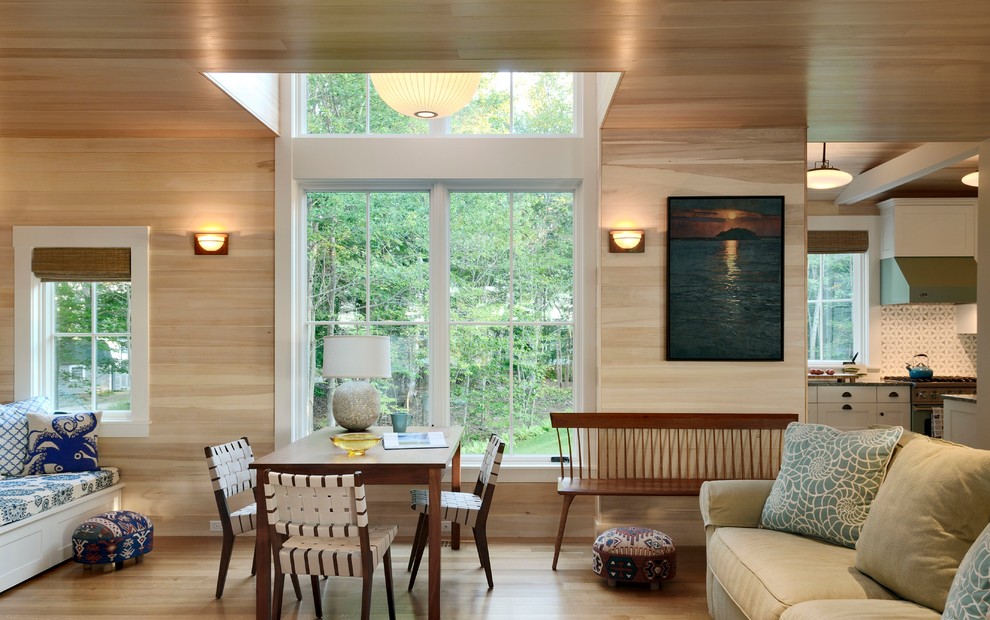 Photo of a beach style open plan games room in Portland Maine with beige walls and light hardwood flooring.