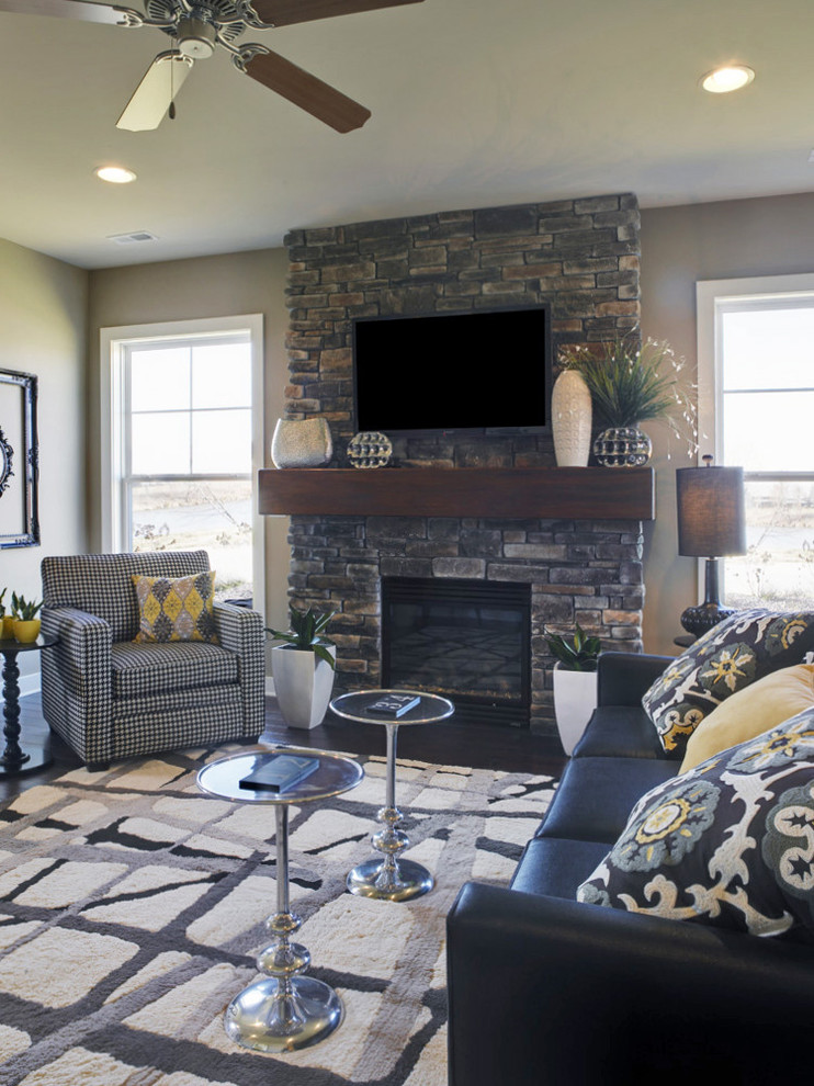 Mid-sized transitional open concept family room photo in Other with gray walls, a standard fireplace, a stone fireplace and a wall-mounted tv
