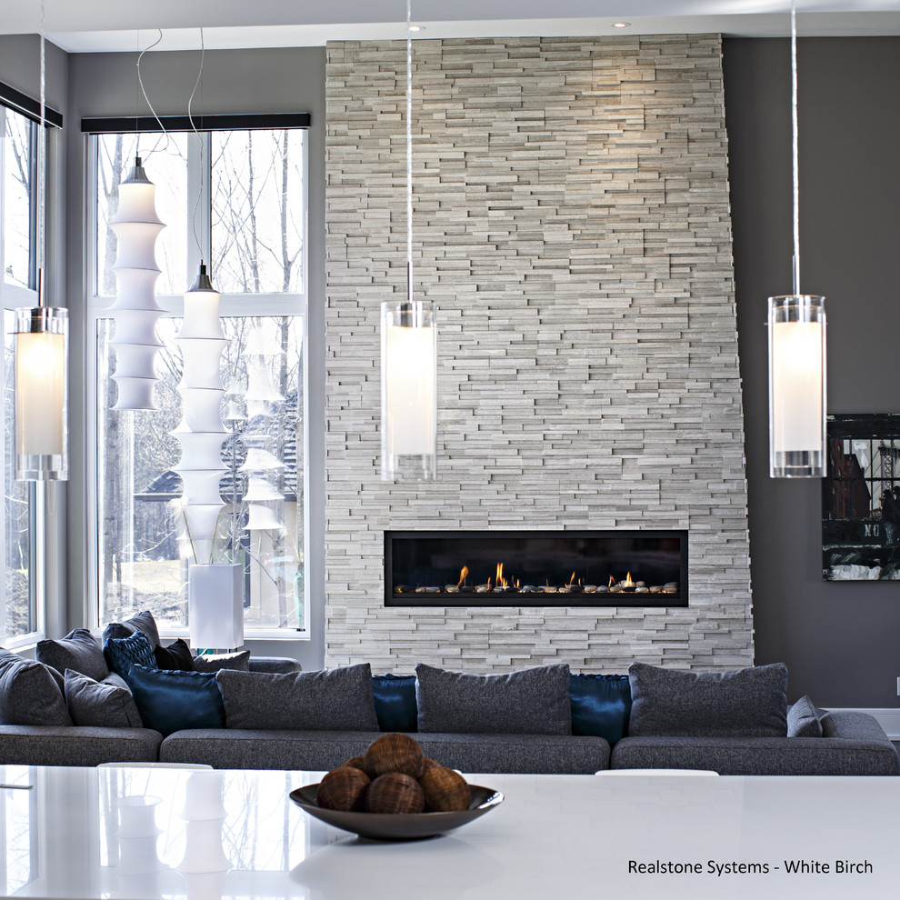 Design ideas for a medium sized contemporary open plan games room in Ottawa with a standard fireplace, a stone fireplace surround, grey walls and no tv.