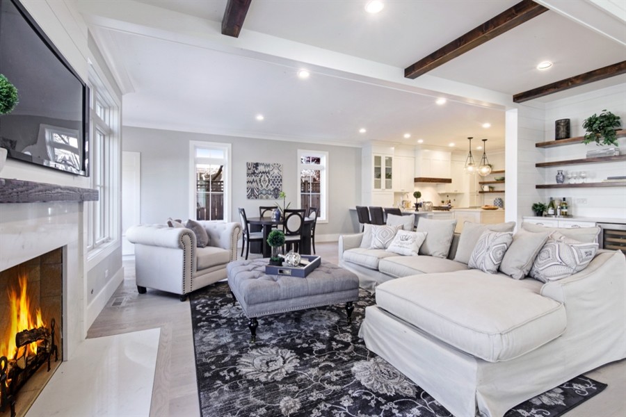 Inspiration for a mid-sized transitional open concept porcelain tile and brown floor family room remodel in Chicago with gray walls, a standard fireplace, a concrete fireplace and a tv stand