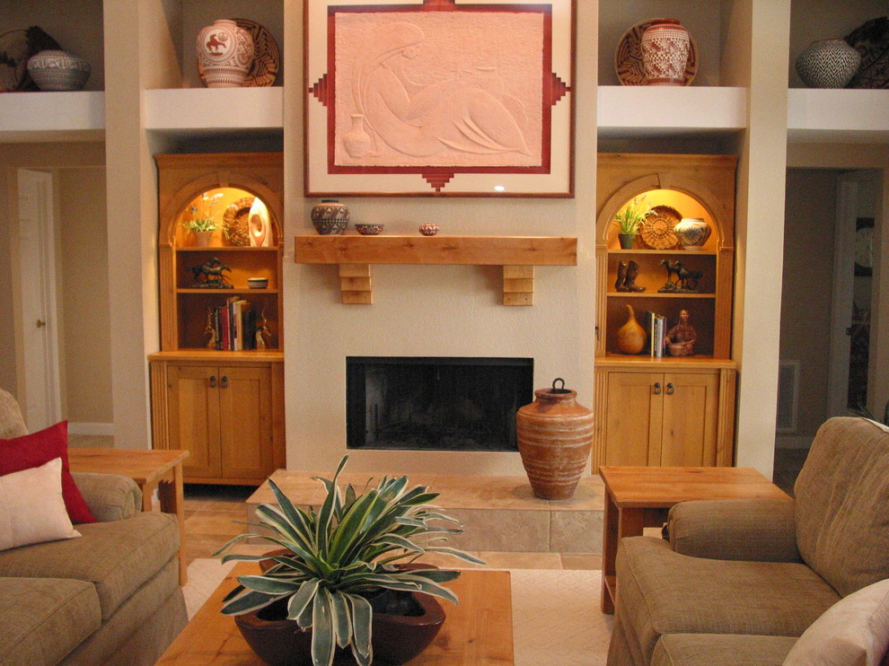 Inspiration pour une salle de séjour sud-ouest américain de taille moyenne et ouverte avec un mur beige, un sol en travertin, une cheminée standard et un manteau de cheminée en bois.