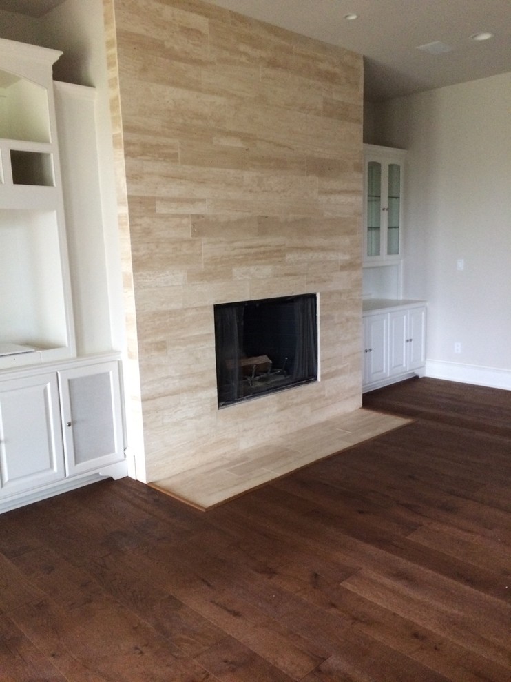 Inspiration for a contemporary games room in Austin with dark hardwood flooring and a stone fireplace surround.