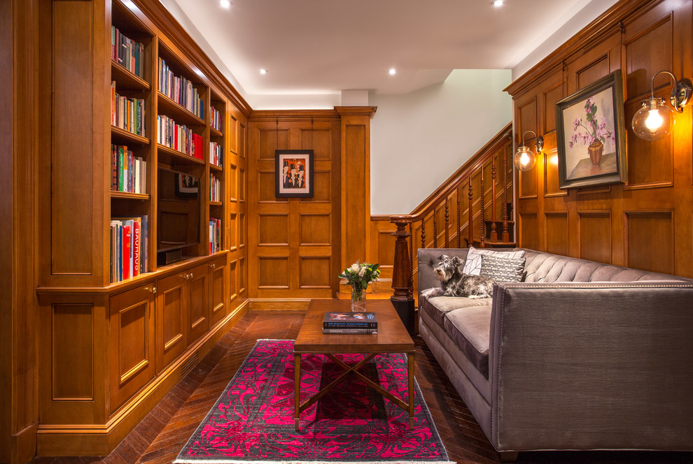Inspiration for a classic games room in Boston with a reading nook, brown walls, dark hardwood flooring, no fireplace, a built-in media unit and brown floors.