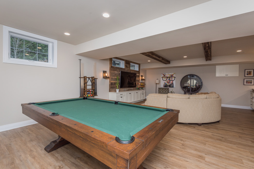 Inspiration for a large transitional open concept medium tone wood floor and brown floor game room remodel in Louisville with gray walls, no fireplace and a wall-mounted tv