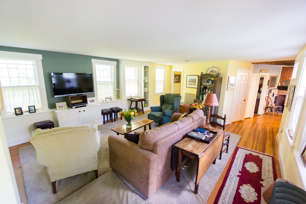 Example of a farmhouse family room design in Providence
