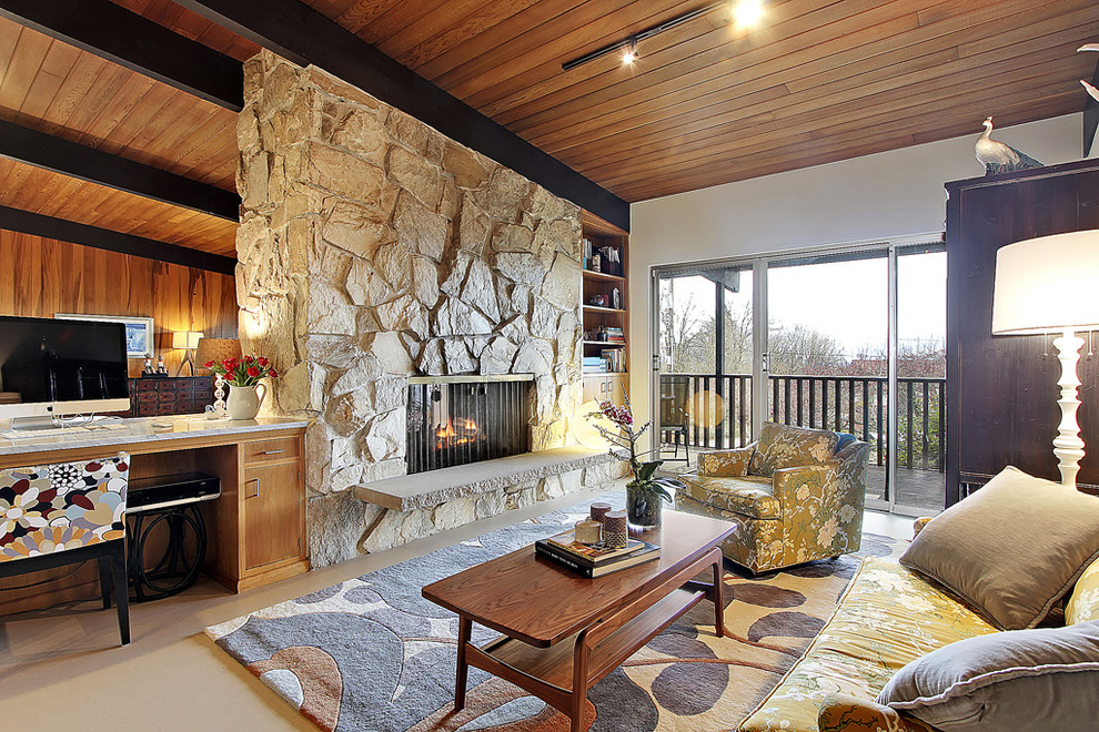 Idée de décoration pour une salle de séjour vintage avec un manteau de cheminée en pierre.