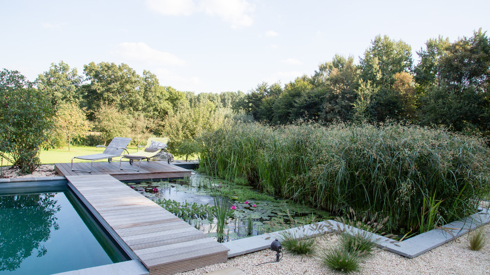 Inspiration for a traditional garden in Other with a pond and decking.