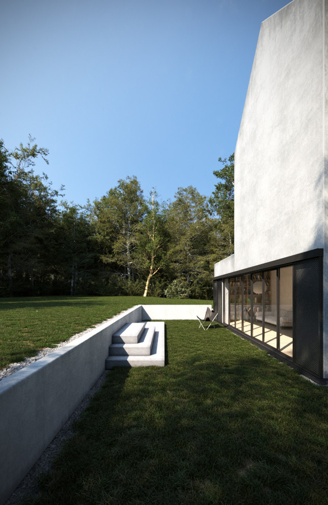 Réalisation d'un jardin latéral minimaliste de taille moyenne et l'été avec un mur de soutènement, une exposition partiellement ombragée et des pavés en béton.