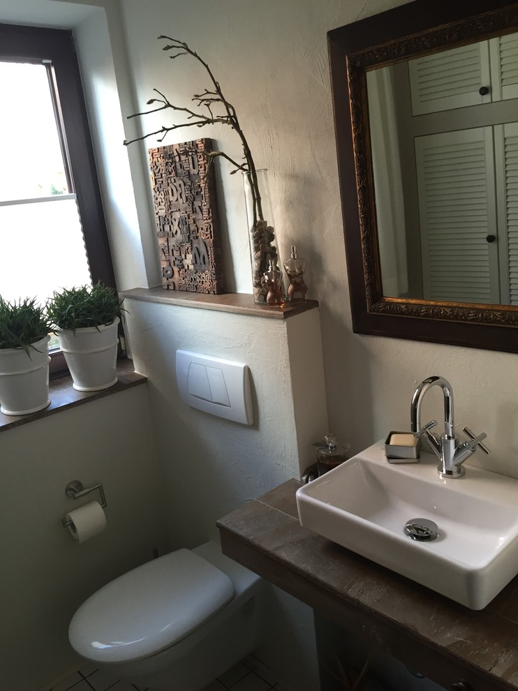 Immagine di un piccolo bagno di servizio minimal con pareti beige