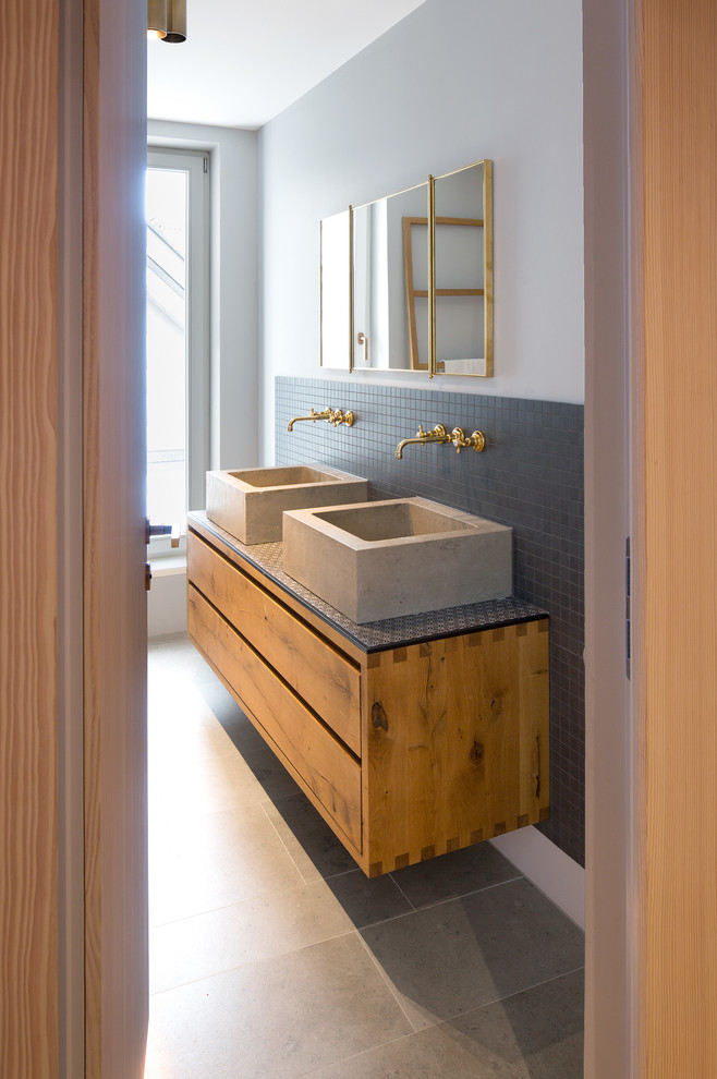 Design ideas for a medium sized cloakroom in Other with beaded cabinets, medium wood cabinets and a floating vanity unit.
