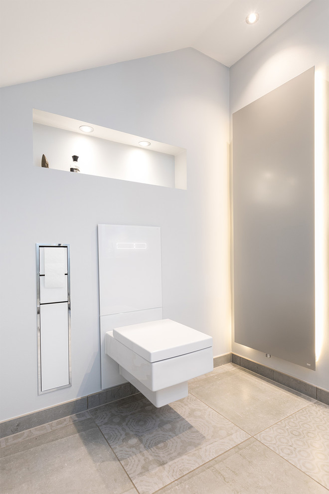 Photo of a contemporary cloakroom in Dortmund with a wall mounted toilet.