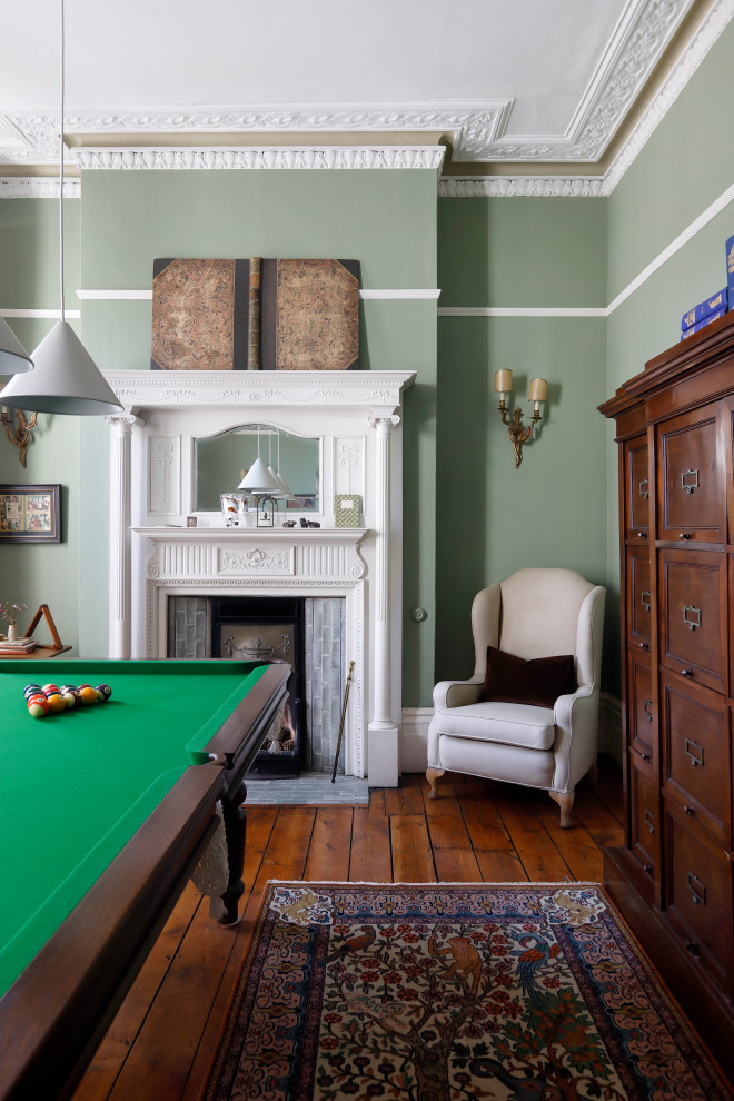 Photo of a traditional games room in Sussex with a game room, green walls, dark hardwood flooring and brown floors.