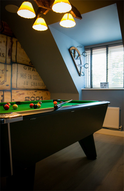 This is an example of a rustic games room in Essex.