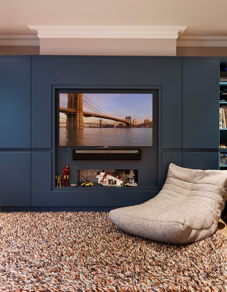 Contemporary games room in London with grey walls and a built-in media unit.