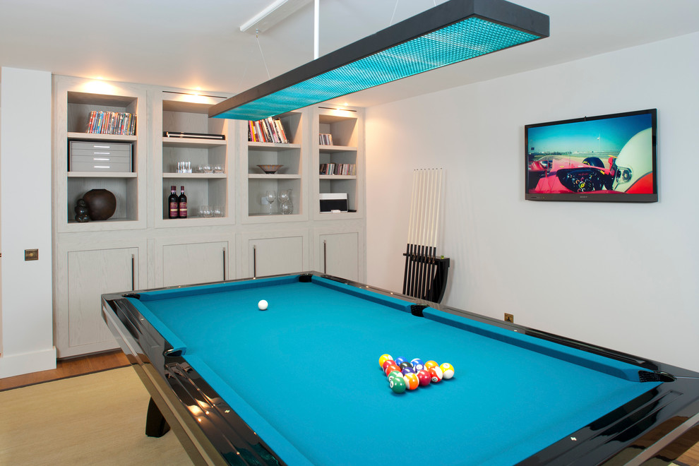 This is an example of a contemporary games room in London with no fireplace.