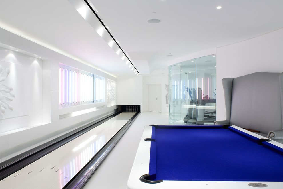 Design ideas for a contemporary enclosed games room in London with white walls and no tv.