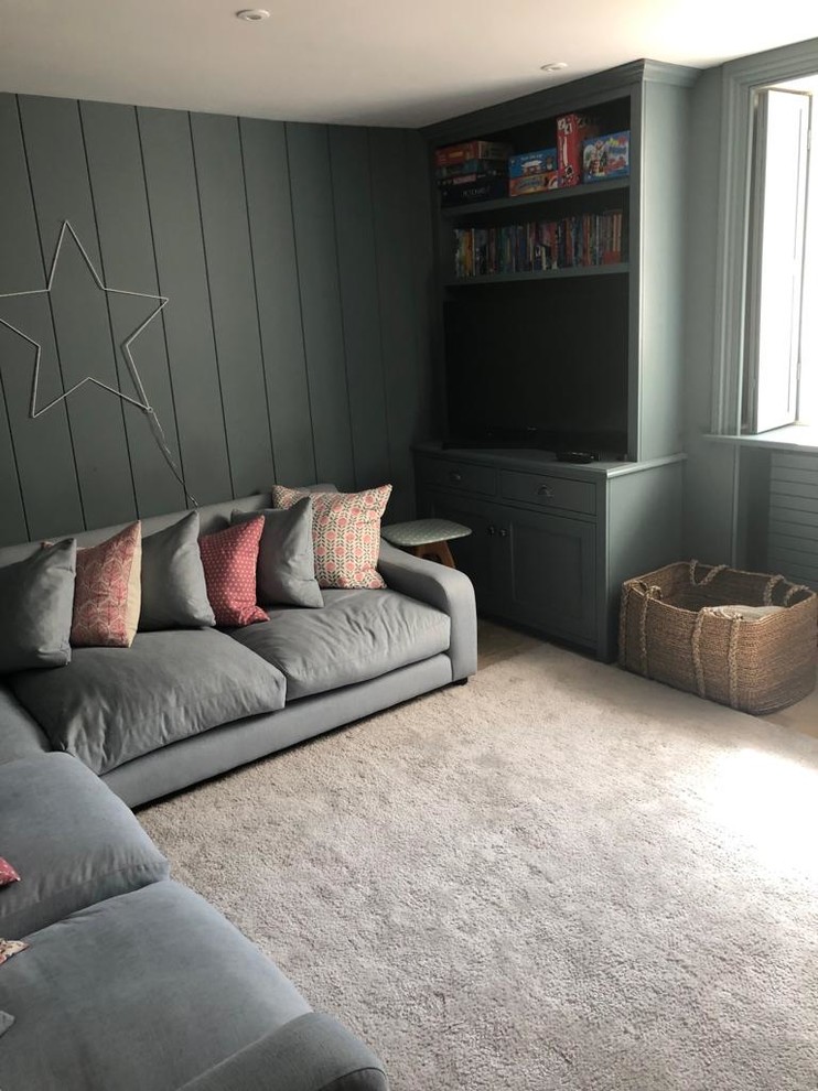 Example of a farmhouse family room design in Gloucestershire