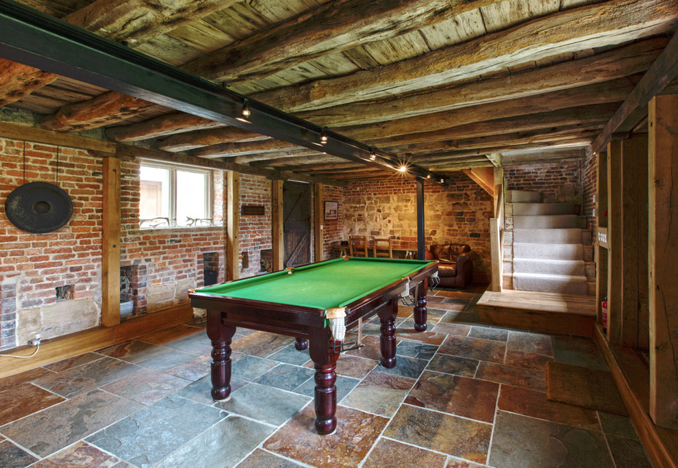 Design ideas for a medium sized rustic games room in Essex with red walls.