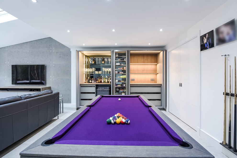 Inspiration for a medium sized contemporary open plan games room in London with white walls, a wall mounted tv and grey floors.