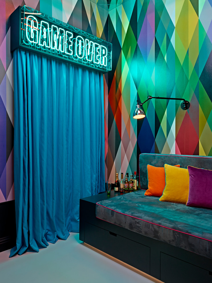 This is an example of an eclectic enclosed games room in London with a game room and multi-coloured walls.