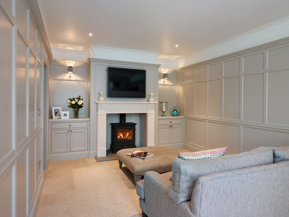 Inspiration for a large contemporary open plan games room in Essex with grey walls, a standard fireplace and a wall mounted tv.