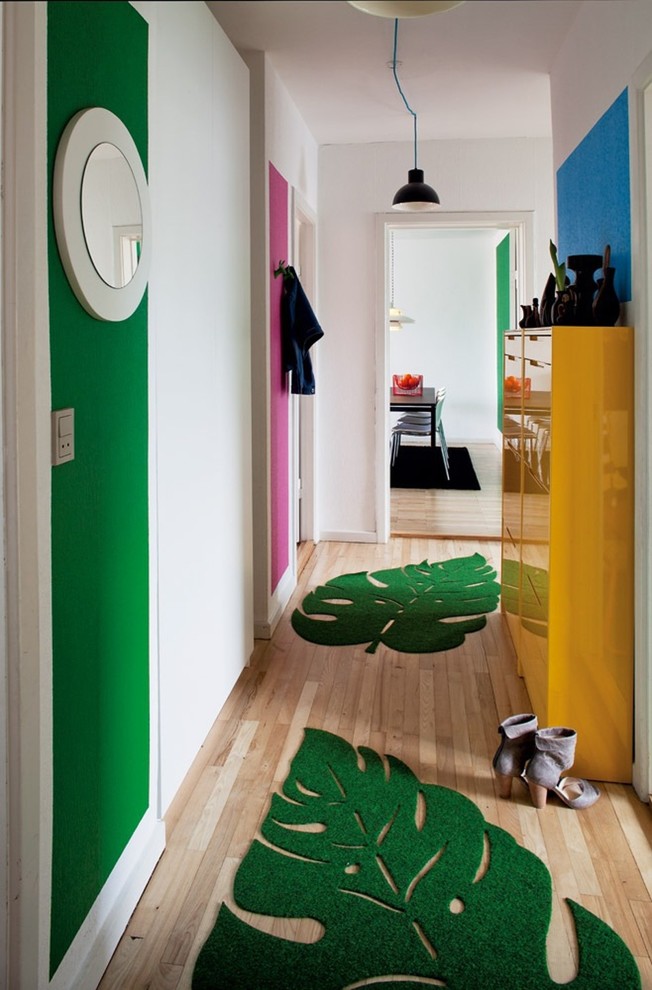 Mid-sized danish light wood floor hallway photo in Aarhus with white walls