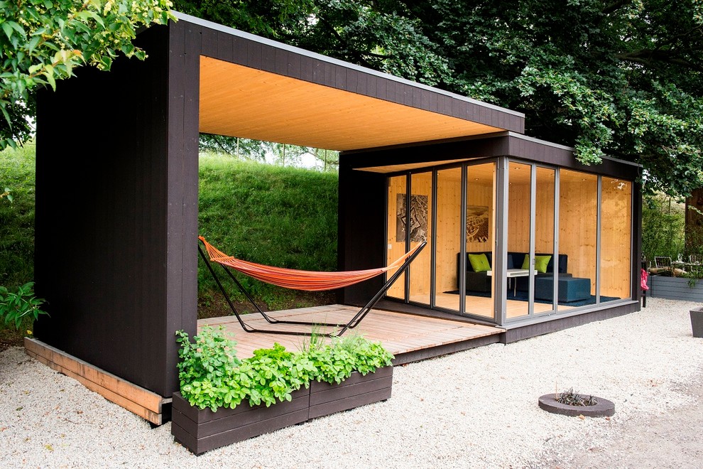 Design ideas for a medium sized modern garden shed and building in Gothenburg.