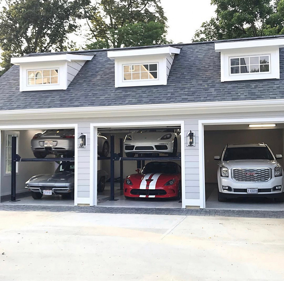 Стильный дизайн: большой отдельно стоящий гараж для четырех и более машин - последний тренд