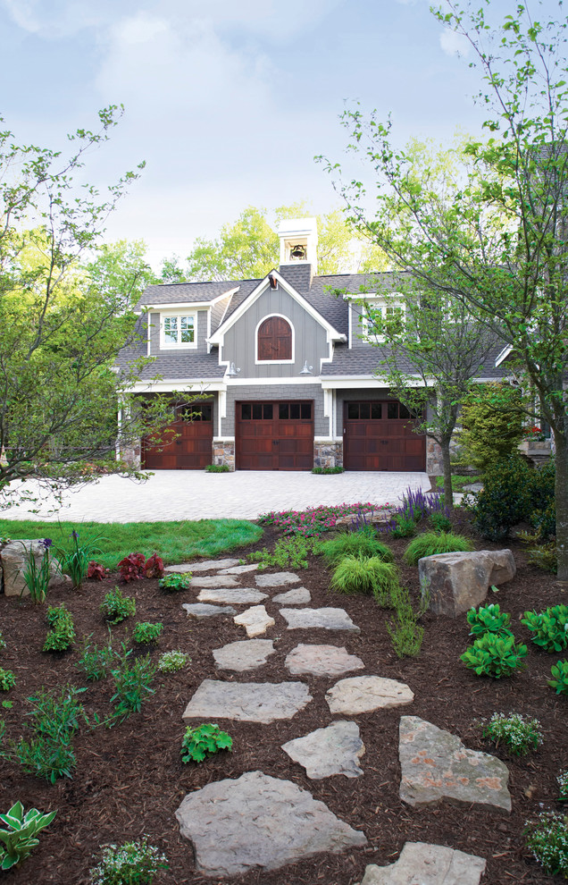 Large mountain style attached three-car garage photo in Wilmington