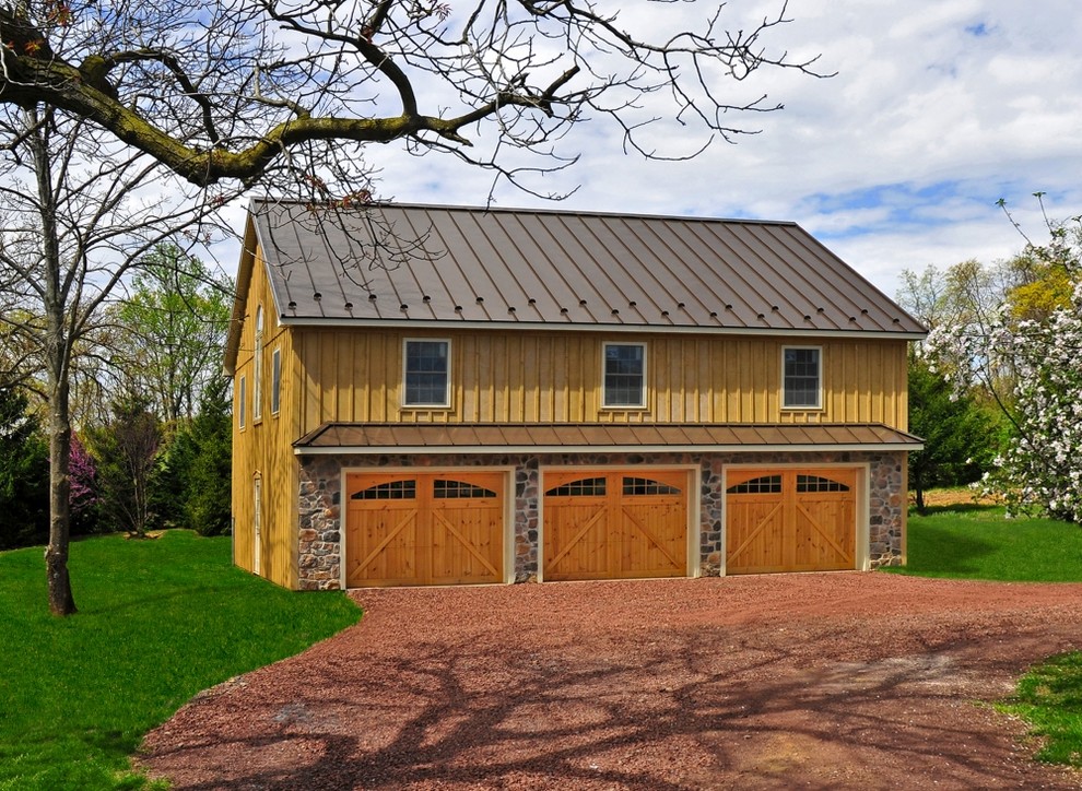 Garage - large traditional detached three-car garage idea in Other