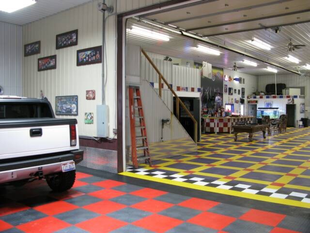 Garage - huge traditional detached three-car garage idea in Cedar Rapids