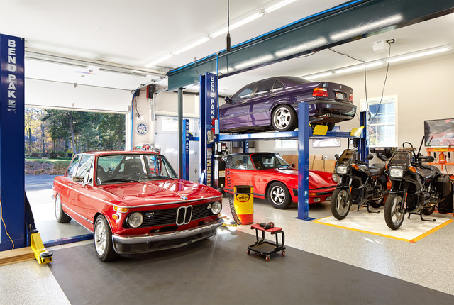 A Mechanic's Garage with Pool House above - Modern - Garage