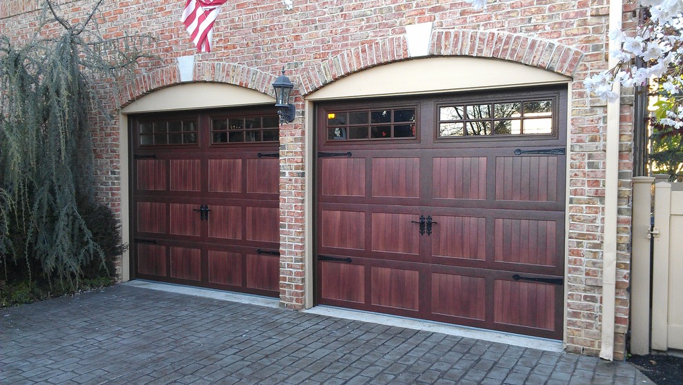 Mid-sized elegant attached two-car garage photo in New York