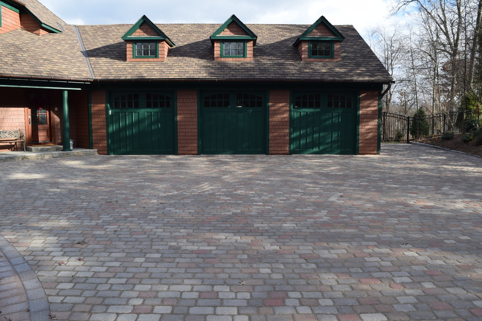 This is an example of a medium sized traditional detached garage in New York with three or more cars.