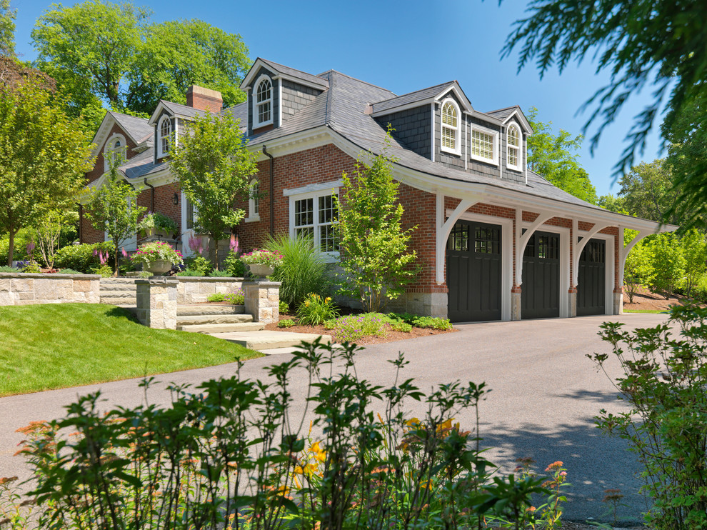 Garage - traditional attached three-car garage idea in Boston