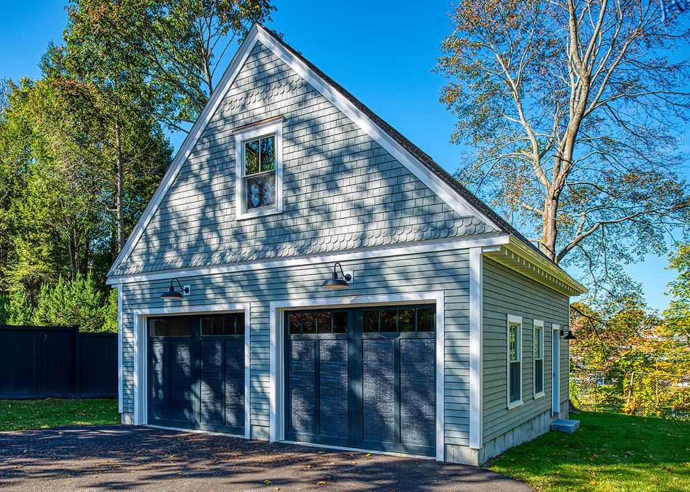 Example of a mid-sized classic detached two-car garage design in Boston