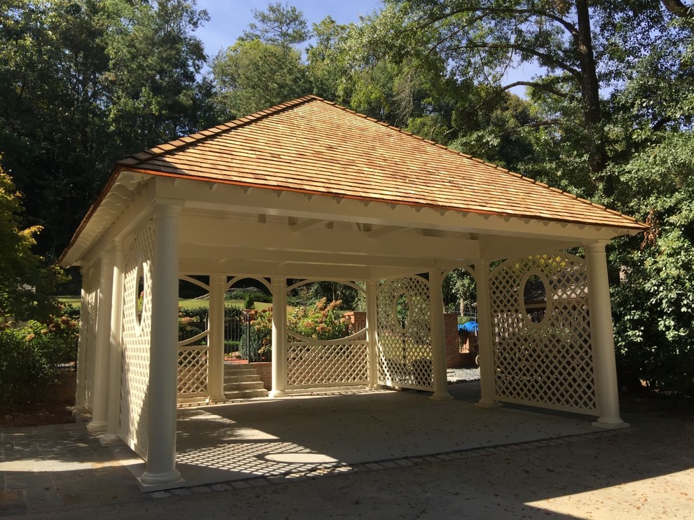 Example of a mid-sized classic detached two-car carport design in Atlanta