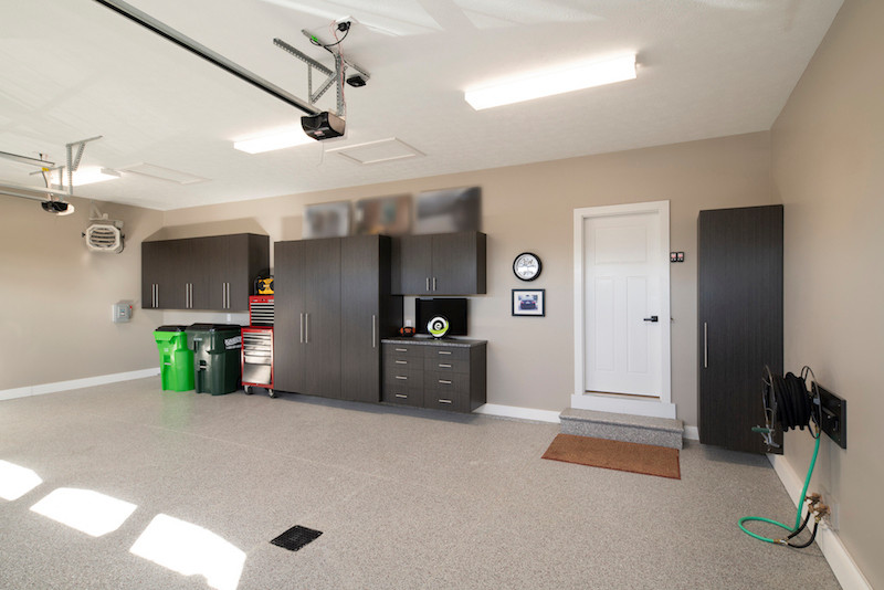 Inspiration for an attached three-car garage remodel in Cleveland