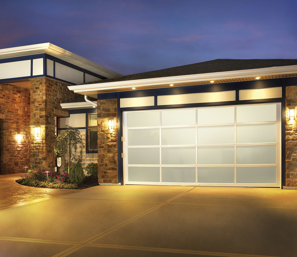 This is an example of a medium sized modern attached double garage in Kansas City.