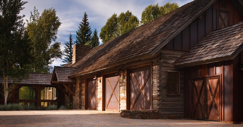 Inspiration for a huge rustic attached four-car garage remodel in Jackson