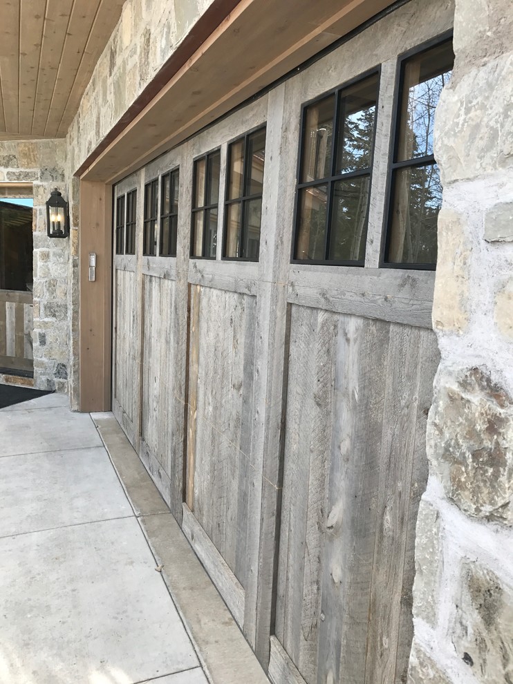 This is an example of a medium sized rustic attached double garage in Salt Lake City.