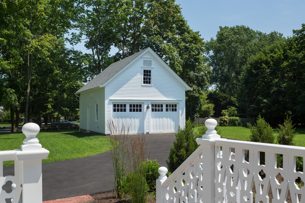 Garage - farmhouse detached two-car garage idea in Providence